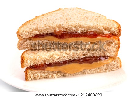 classic peanut butter and strawberry jelly sandwich on wheat