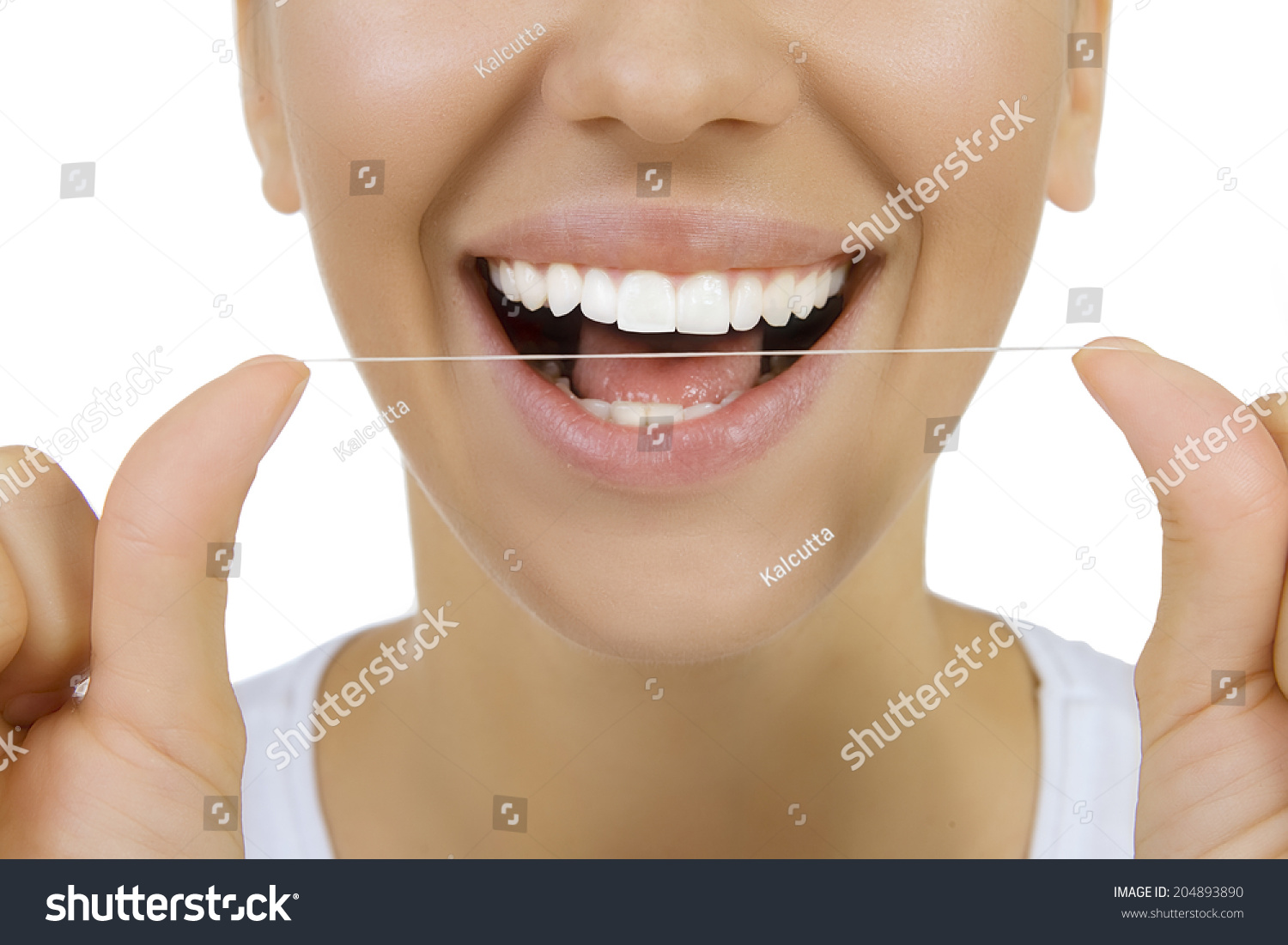 清洁牙齿的牙线牙齿(接近女人的微笑) 原标题 woman and teeth floss