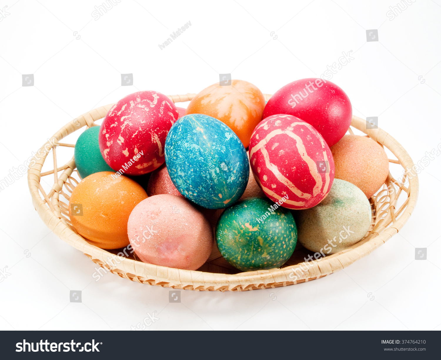 pile of painted easter eggs isolated on white background.